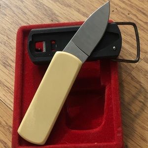 Vintage Gerber Touché belt buckle knife. Ivory Micarta handle, never worn. Mint